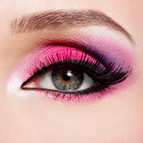 closeup female eye with beautiful fashion bright pink makeup